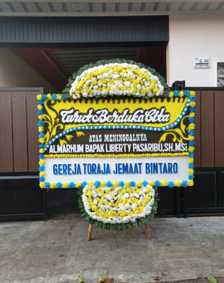 Papan Bunga Duka di Jekan Raya